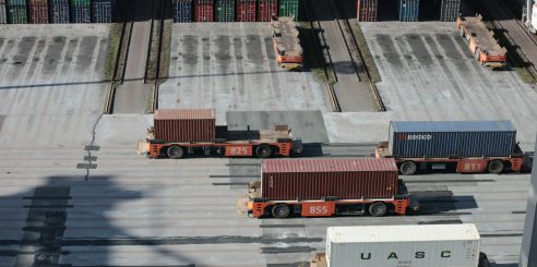 white and red truck on road during daytime